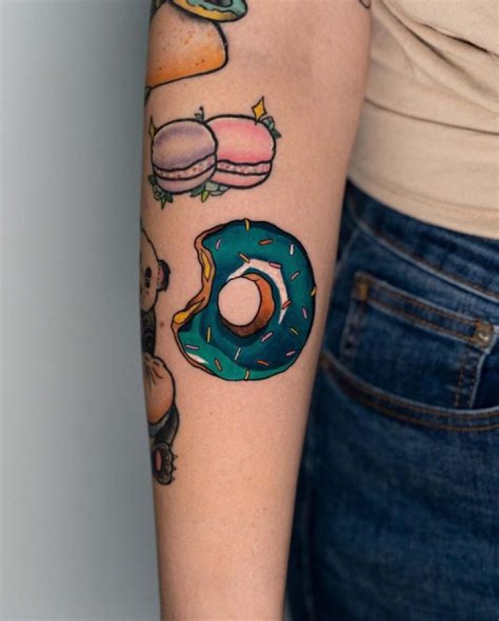 Madame Donut Tattoo: Arm Scarification Meaning